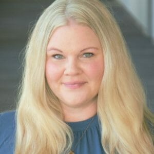 Heather Schmitt wearing a blue shirt and smiling