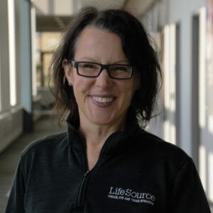 Emily Larimer smiling in LifeSource branded jacket