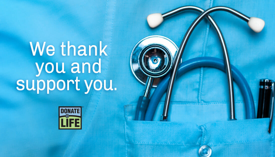 A stethoscope sitting in the front pocket of a blue shirt with quote that says We thank you and support you